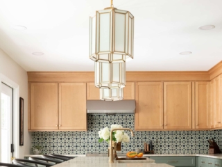 TEW DESIGN STUDIO | HEATHER RIDGE KITCHEN Length-wise view of light fixtures showcasing three pendant bar lighting.