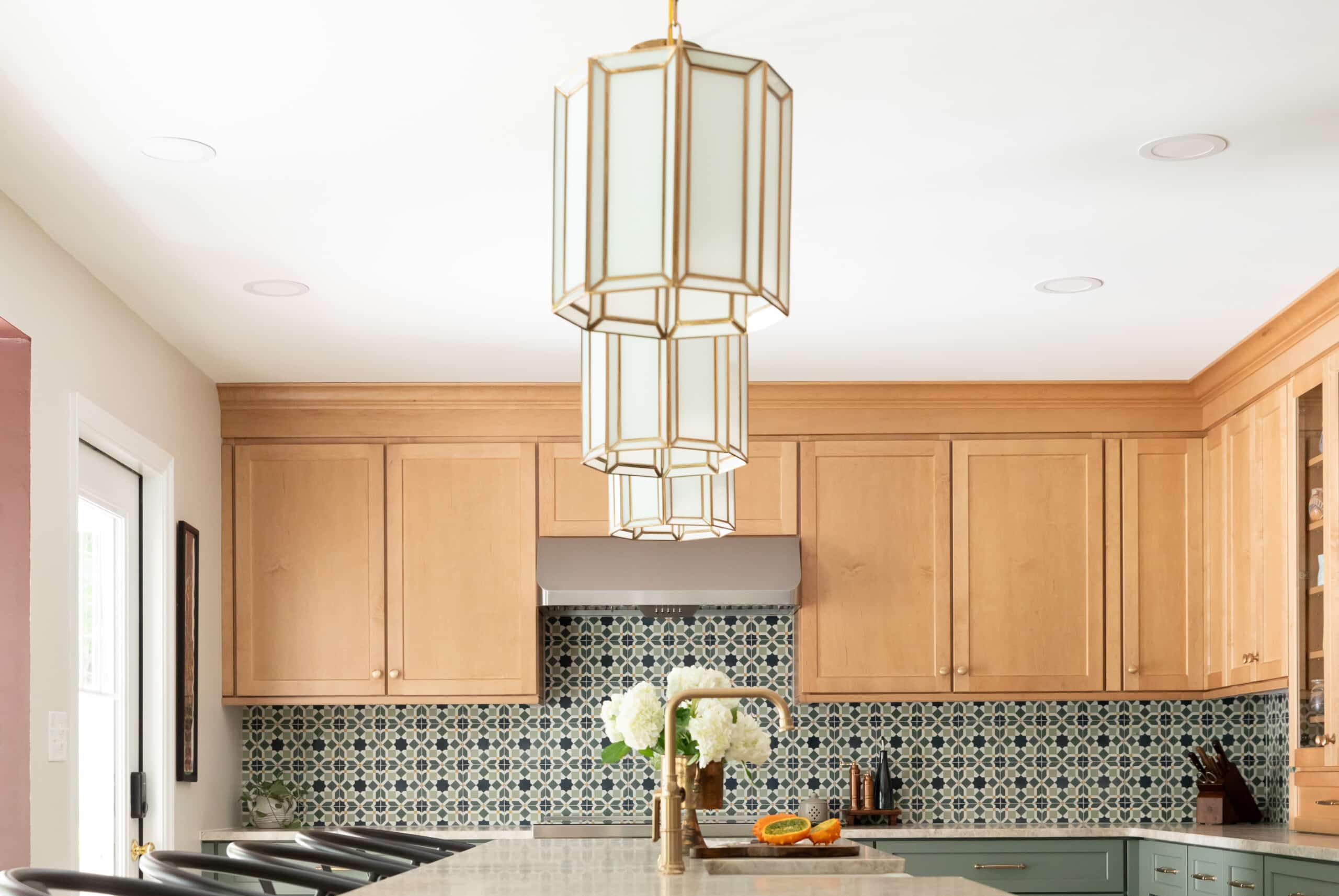 Length-wise view of light fixtures showcasing three pendant bar lighting.