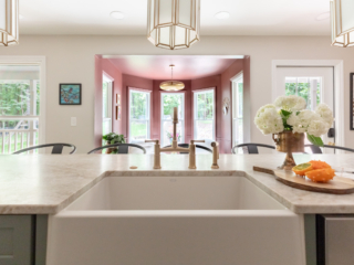 TEW DESIGN STUDIO | HEATHER RIDGE KITCHEN Peek into breakfast nook viewing from farmhouse sink and brass fixtures.
