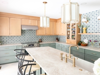 TEW DESIGN STUDIO | HEATHER RIDGE KITCHEN Diagonal view of kitchen showcasing light fixtures, brass hardware, natural textures and earth tones.
