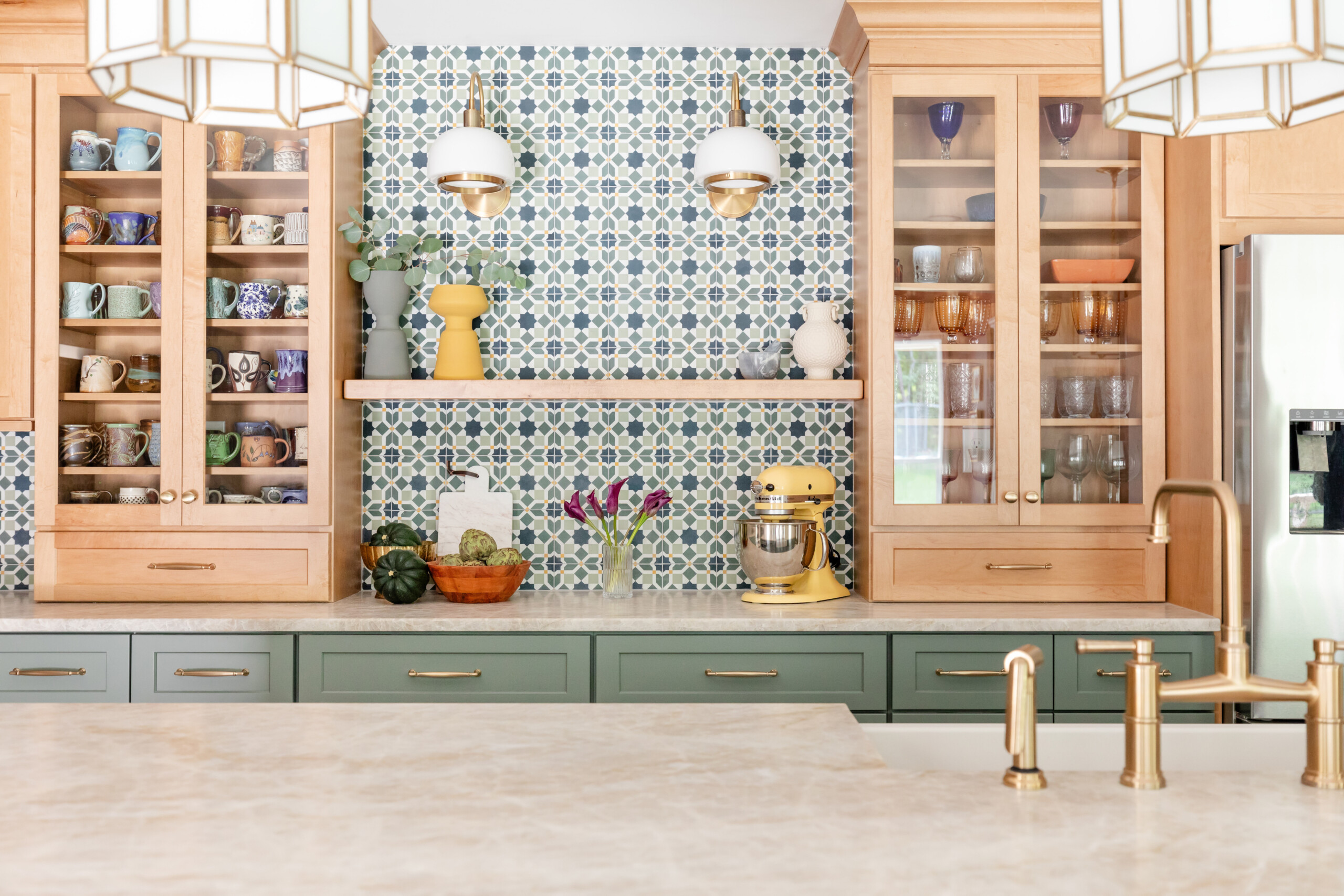 Display glass cabinetry with Moroccan-inspired patterns and beautiful natural light.