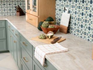 TEW DESIGN STUDIO | HEATHER RIDGE KITCHEN View of marble counters with brass hardware and Moroccan patterns, highlighting kitchen space.