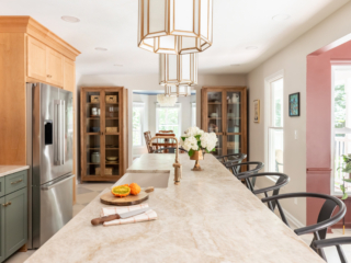 TEW DESIGN STUDIO | HEATHER RIDGE KITCHEN Length-wise view of marble kitchen island with views in formal dining and nook.