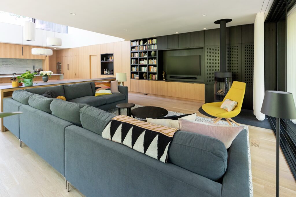 Open-plan living room design in a Raleigh new construction home by TEW Design Studio