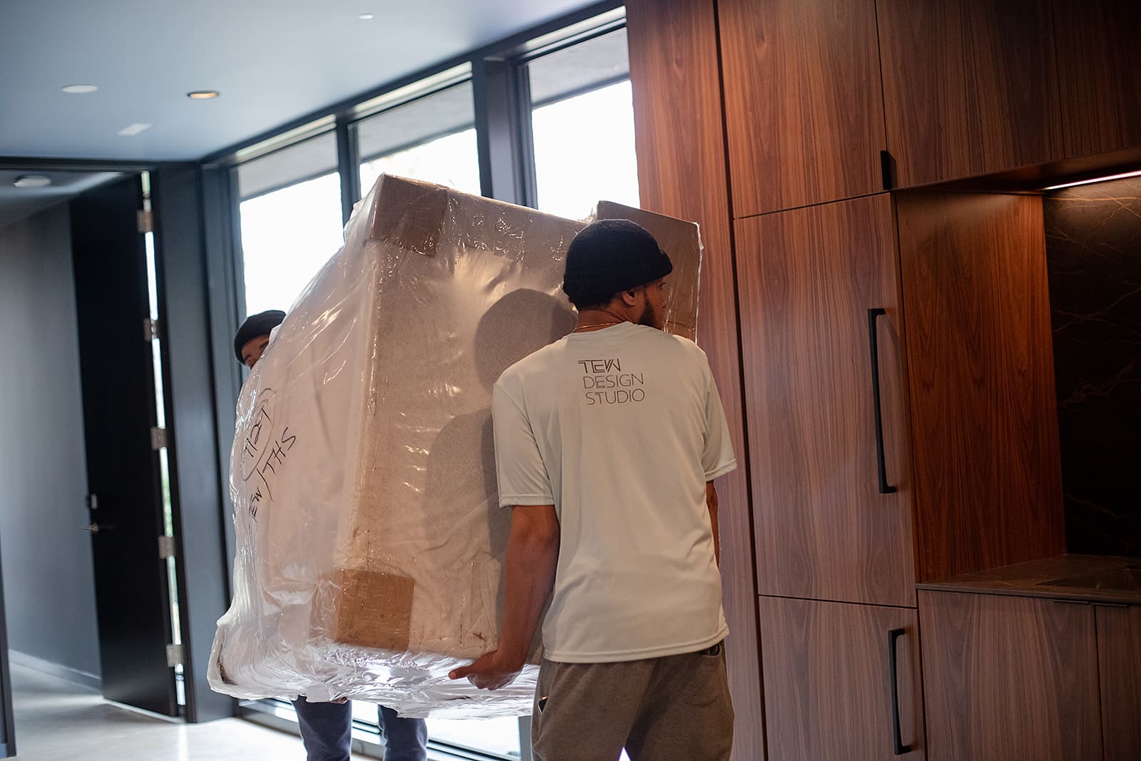 TEWcrew moving furniture in for full-service client